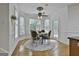 Cozy dining area includes a table with four chairs and large bay windows with natural light at 164 Interlochen Dr, Peachtree City, GA 30269