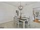 Elegant dining room featuring modern light fixture and neutral color palette at 164 Interlochen Dr, Peachtree City, GA 30269
