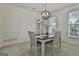 Elegant dining room featuring modern light fixture and neutral color palette at 164 Interlochen Dr, Peachtree City, GA 30269