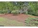 Beautifully landscaped front yard on a large lot at 164 Interlochen Dr, Peachtree City, GA 30269