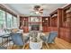 Comfortable living room showcasing hardwood floors, a stone fireplace, and elegant decor at 164 Interlochen Dr, Peachtree City, GA 30269