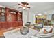 Open-concept living room with built-ins and seamless flow to the kitchen at 164 Interlochen Dr, Peachtree City, GA 30269