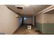 Unfinished basement with a door to the exterior, offering a blank canvas for future living space at 766 Virginia Cir, Forest Park, GA 30297