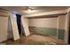 A basement area with potential; includes a partially finished wall and some doors for future renovation at 766 Virginia Cir, Forest Park, GA 30297