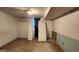 Unfinished basement room with moisture on the concrete floor with spare doors at 766 Virginia Cir, Forest Park, GA 30297
