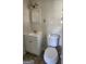 Bathroom featuring a toilet, tile floors, and vanity with white cabinets at 766 Virginia Cir, Forest Park, GA 30297