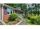 Brick home exterior showing shuttered windows, updated railings, and manicured landscaping at 766 Virginia Cir, Forest Park, GA 30297