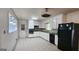 Bright kitchen with white cabinets, tile backsplash, and stainless steel appliances at 766 Virginia Cir, Forest Park, GA 30297