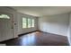 Bright living room features hardwood floors and large windows at 766 Virginia Cir, Forest Park, GA 30297