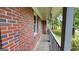 Side view of porch showing brickwork and painted posts at 766 Virginia Cir, Forest Park, GA 30297