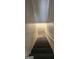 View of the stairwell and dark-colored staircase, leading to an upper or lower level of the property at 766 Virginia Cir, Forest Park, GA 30297