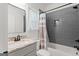 Bathroom featuring gray tile, modern vanity, and neutral accents at 23 Skyland W Dr, Locust Grove, GA 30248