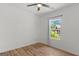 Cozy bedroom with a ceiling fan, wood floors and natural lighting at 23 Skyland W Dr, Locust Grove, GA 30248