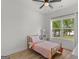 Sunny bedroom with a twin bed and a view of the lake at 23 Skyland W Dr, Locust Grove, GA 30248