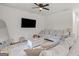 Bright living room featuring a comfortable sofa and large window at 23 Skyland W Dr, Locust Grove, GA 30248