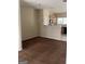 Open-concept living room with brown carpet and view of the kitchen at 8170 Oakley Cir # 2, Union City, GA 30291