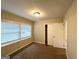 Inviting bedroom with carpet flooring, neutral paint, a closet, and a view of a room beyond at 3115 Pinehill Dr, Decatur, GA 30032