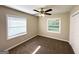 Cozy bedroom featuring carpet flooring, neutral paint, natural light, and a ceiling fan with lighting at 3115 Pinehill Dr, Decatur, GA 30032