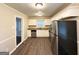 Well-lit kitchen featuring stainless steel appliances, white cabinets, granite countertops, and dark floors at 3115 Pinehill Dr, Decatur, GA 30032