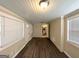 Bright living area with hardwood floors, white brick accents, and multiple windows for abundant natural light at 3115 Pinehill Dr, Decatur, GA 30032