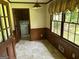 Inviting dining room featuring a window, paneling and access to the laundry room at 5125 Flakes Mill Rd, Ellenwood, GA 30294
