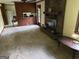 Spacious living room featuring a brick fireplace, carpet floors, and lots of natural light at 5125 Flakes Mill Rd, Ellenwood, GA 30294