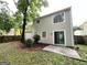 Home's backyard with fence and sliding door entrance at 1362 Mill Lake Cir, Stone Mountain, GA 30088