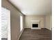 Cozy living room with decorative fireplace and large windows for natural light at 1362 Mill Lake Cir, Stone Mountain, GA 30088