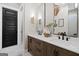 Elegant bathroom with dual sinks, white marble countertops, and dark wood cabinets at 2490 S Carroll St, Villa Rica, GA 30180
