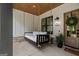 Inviting front porch with a porch swing, wood ceiling, and stone accents creating a cozy outdoor space at 2490 S Carroll St, Villa Rica, GA 30180