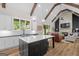 Well-designed open concept, connecting the kitchen and living room, with stainless appliances, a large island and natural light at 2490 S Carroll St, Villa Rica, GA 30180