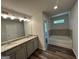 Bathroom featuring soaking tub and granite top vanity at 142 Tye St, Stockbridge, GA 30281