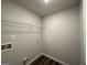 Laundry room with overhead shelf at 142 Tye St, Stockbridge, GA 30281