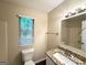 Well-maintained bathroom features a granite vanity, tile floors, and a tub with shower at 2146 Wingfoot Pl, Decatur, GA 30035