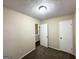 Carpeted bedroom featuring neutral walls, textured ceilings, and a closet for convenient storage at 2146 Wingfoot Pl, Decatur, GA 30035