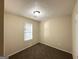 Simple bedroom with neutral walls, carpet flooring, and a window with blinds at 2146 Wingfoot Pl, Decatur, GA 30035