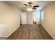 Spacious carpeted bedroom with a ceiling fan, ensuite bathroom, and natural light at 2146 Wingfoot Pl, Decatur, GA 30035