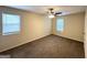 Spacious bedroom with carpet, a ceiling fan, and natural light from two windows at 2146 Wingfoot Pl, Decatur, GA 30035