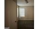 Well-lit bedroom featuring carpet flooring and a window with blinds for privacy at 2146 Wingfoot Pl, Decatur, GA 30035