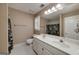 Bathroom featuring double sink vanity, a large mirror, and tile floors at 170 Glen Eagle Way, Mcdonough, GA 30253