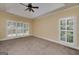 Bright bedroom with large windows, natural light, and fan in the ceiling at 170 Glen Eagle Way, Mcdonough, GA 30253