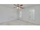 A bedroom is shown with white walls, two windows with white shutters, and a ceiling fan at 170 Glen Eagle Way, Mcdonough, GA 30253