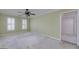 A bedroom featuring a ceiling fan and natural light from windows with white shutters, offering a bright space at 170 Glen Eagle Way, Mcdonough, GA 30253