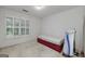 Bedroom featuring a window with shutters, a bed frame with storage and a Total Gym machine at 170 Glen Eagle Way, Mcdonough, GA 30253