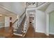 Spacious foyer with staircase and hardwood flooring throughout at 170 Glen Eagle Way, Mcdonough, GA 30253