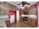 The kitchen includes stainless steel appliances and wooden cabinetry at 170 Glen Eagle Way, Mcdonough, GA 30253