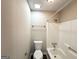 Bathroom showcasing a toilet, shower-tub, and towel rack at 1918 Leigh Sw Dr, Conyers, GA 30094