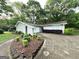 Exterior of home showcasing brick facade, arched entry, and manicured landscaping at 1918 Leigh Sw Dr, Conyers, GA 30094