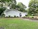 Exterior view of a grey painted brick home with tidy landscaping at 1918 Leigh Sw Dr, Conyers, GA 30094
