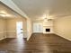 Spacious living room featuring hardwood floors, fireplace and french doors at 1918 Leigh Sw Dr, Conyers, GA 30094